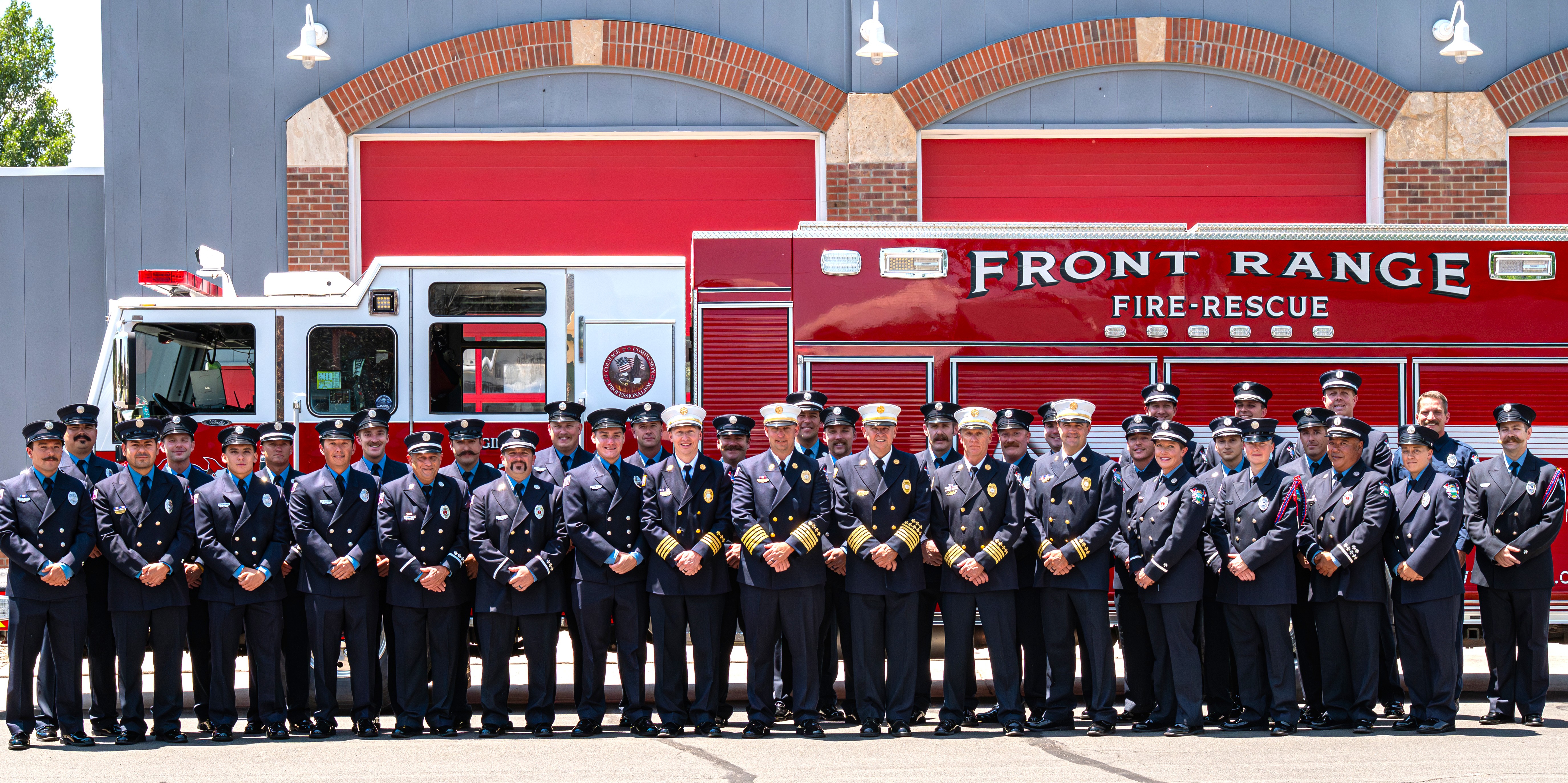 Picture of Firefighters in front of Fire Engine