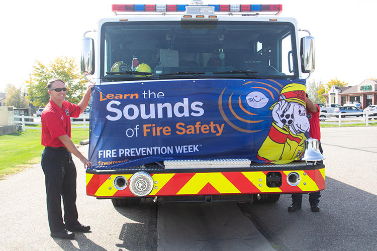 Fire Prevention Week Banner on the front of a Firetruck