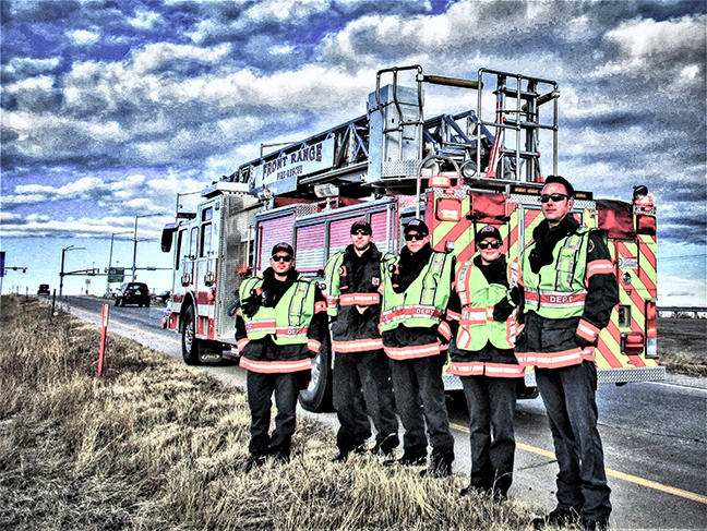 Picture of Five Firefighers Standing in front of Fire Truck