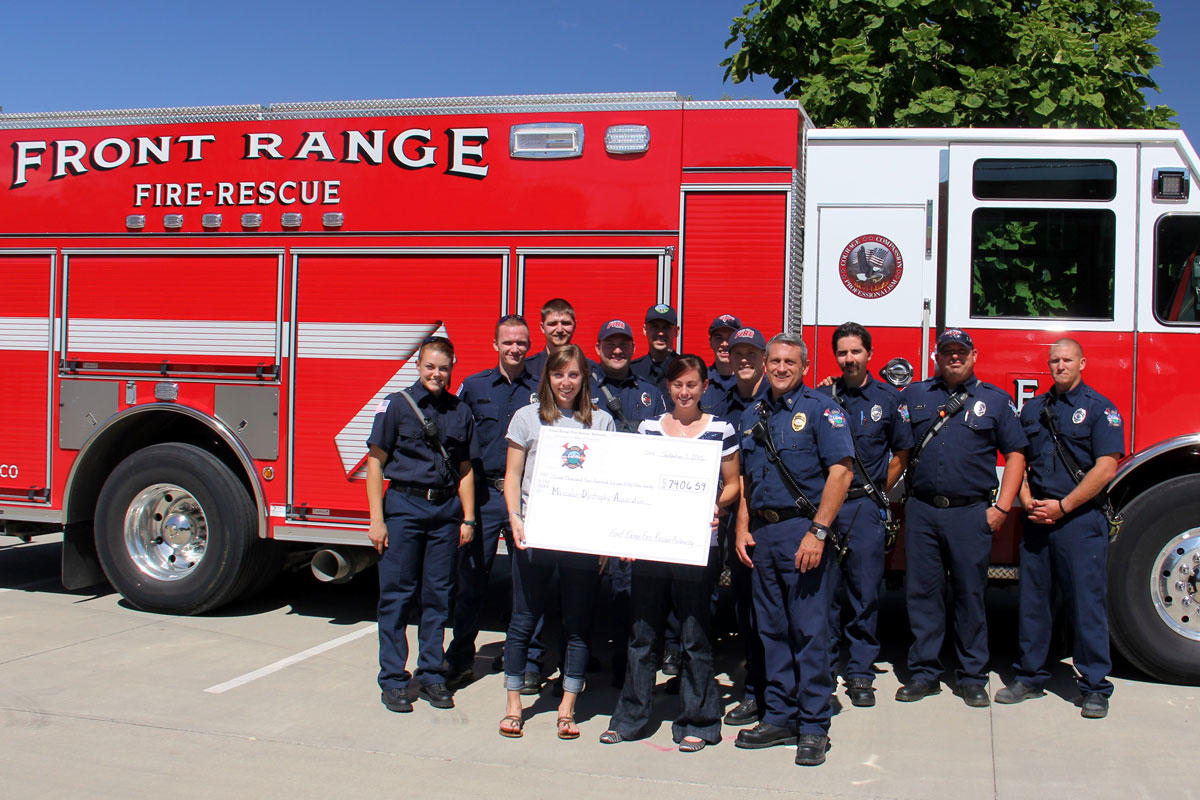 Front Range Fire Authority Firefighters Holding Large Check of Donation